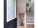 Bright foyer with wooden floor and stairway leading to the upper level at 119 Sourwood Lane, Temple, GA 30179