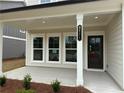 Inviting front porch with stylish columns and a clearly marked house number at 2101 Boxwood Circle Se, Conyers, GA 30094