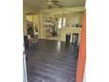 Open-concept living area with contemporary flooring, natural light, and easy access to other rooms at 867 Commodore Nw Dr, Atlanta, GA 30318