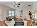 Stylish living room with modern furniture, a ceiling fan, and hardwood floors at 1112 Birch Sw St, Atlanta, GA 30310