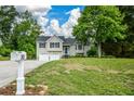 Attractive home with an attached garage, complemented by a green lawn and front yard landscaping at 30 W Fork Way, Temple, GA 30179