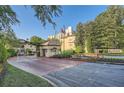 Community entrance with flags, fountains, and lush landscaping create a welcoming and prestigious atmosphere at 3777 Peachtree Ne Rd # 412, Brookhaven, GA 30319