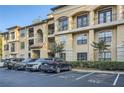 Well-maintained apartment building featuring reserved parking spaces, lush landscaping, and refined architectural details at 3777 Peachtree Ne Rd # 412, Brookhaven, GA 30319