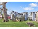 A backyard featuring a deck, green lawn, and mature trees offering a private outdoor space at 1087 Longley Nw Ave, Atlanta, GA 30318