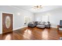 Bright living room featuring hardwood floors, neutral walls, and a comfortable sofa at 1087 Longley Nw Ave, Atlanta, GA 30318