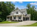 Beautiful two-story home featuring gray brick, white siding, and an attached two-car garage at 4383 Capstone Ne Ct, Roswell, GA 30075