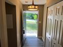 Welcoming entryway with wood-look floors, closet, and a view to the outdoors at 2705 Rhoanoke Dr, Duluth, GA 30096