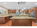 Gourmet kitchen featuring an island, stainless steel appliances, and custom cabinetry at 4608 Rosemear Ct, Norcross, GA 30093