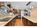 Modern kitchen featuring stainless steel appliances, granite countertops, and a stylish backsplash at 4608 Rosemear Ct, Norcross, GA 30093