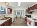 Eat-in kitchen features updated appliances, bright windows and lovely bay window dining nook at 2880 Field Spring Dr, Lithonia, GA 30058