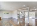 Bright, open-concept living room and kitchen space with hardwood floors and plenty of natural light at 2103 Columbia Dr, Decatur, GA 30032