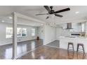 This living room features hardwood floors and an open concept leading to the kitchen at 2103 Columbia Dr, Decatur, GA 30032