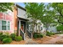 Street view of colorful townhomes showcasing well-maintained landscaping and inviting front entrances at 3642 Princeton Ave, Atlanta, GA 30337