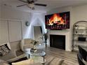Inviting living room with a fireplace, stylish decor, and neutral colors creating a cozy atmosphere at 7621 Gray Pointe Dr, Lithonia, GA 30058