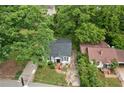 Overhead view of cozy home nestled among mature trees in a neighborhood setting at 1377 Pine Ave, Atlanta, GA 30344