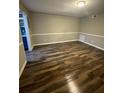 Inviting living room with new floors and neutral paint, perfect for relaxation at 123 Rue Fontaine, Lithonia, GA 30038