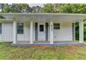 Inviting front porch with decorative stone accents and a covered entrance at 4384 Raven Valley Ct, Decatur, GA 30035