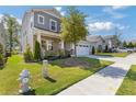 Lovely home with stone accents, a two-car garage, and a well-maintained lawn and landscaping at 704 Chipping Sparrow St, Canton, GA 30115