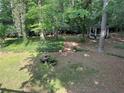 Secluded backyard featuring a gazebo, fountain, and lush landscaping, offering a peaceful outdoor retreat at 125 Fortuna Ct, Roswell, GA 30075