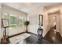 Elegant foyer featuring slate floors, white doors, decorative accents, and abundant natural light at 125 Fortuna Ct, Roswell, GA 30075
