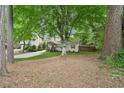 Charming single-Gathering home with a lush, green lawn and mature trees in a serene setting at 2586 Valley Stream Dr, Atlanta, GA 30360