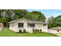 This single-story home boasts a freshly painted exterior, lush lawn, and cozy front porch at 283 Norton Se Cir, Smyrna, GA 30082
