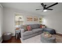 Cozy living room with hardwood floors, a comfortable sofa, and ample natural light at 283 Norton Se Cir, Smyrna, GA 30082