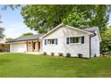 Charming one-story home with a well-manicured lawn and an attached two car garage at 3890 Cherrydale Se Ln, Smyrna, GA 30082
