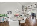 Elegant dining area features hardwood floors, chandelier, stairs to second level and access to kitchen at 4503 Woodhaven Ne, Marietta, GA 30067