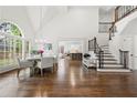 Elegant dining room showcases large windows, hardwood floors, and staircase access to the second floor at 4503 Woodhaven Ne, Marietta, GA 30067