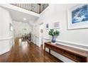 Bright foyer boasts hardwood floors, soaring ceilings, and a view of the dining area at 4503 Woodhaven Ne, Marietta, GA 30067