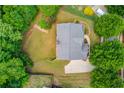 Aerial view of the house showing the spacious, well-maintained backyard and roof at 5960 Bridge Stone Ct, Cumming, GA 30028