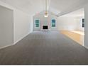 Open living area with fireplace, neutral walls, and beautiful flooring at 30 Trelawney Ct, Covington, GA 30016