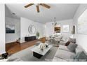 Bright, staged living room features hardwood floors, neutral walls, and plenty of space at 3037 Bonnes Dr, Lithonia, GA 30038