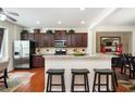 Stylish kitchen featuring granite countertops, stainless steel appliances, and adjacent breakfast bar at 4306 Laurel Creek Se Ct, Smyrna, GA 30080