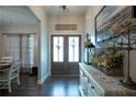Inviting foyer featuring hardwood floors, decorative accents, and a view of the entry door at 62 Presley Farm Pkwy, Rockmart, GA 30153