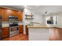 Kitchen with stainless steel appliances, wooden cabinets, granite countertops, and an open layout at 821 Ralph Mcgill Ne Blvd # 2113, Atlanta, GA 30306