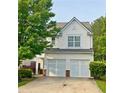 Charming two-story home with a two-car garage and well-maintained landscaping in a suburban setting at 720 Mountain Laurel Dr, Canton, GA 30114