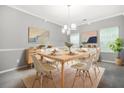 Elegant dining room featuring a stylish table, modern chandelier, and tasteful decor at 6297 Polar Fox Ct, Riverdale, GA 30296