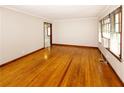 Bright living room with hardwood floors and natural light from the windows at 1025 Cheaves St, Forest Park, GA 30297