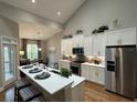 Modern kitchen featuring stainless steel appliances, white cabinetry, and a breakfast bar at 2503 Wollerton St # 2503, Cumming, GA 30040
