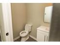 Cozy bathroom with modern toilet and single vanity sink at 2751 Colonial Dr, College Park, GA 30337