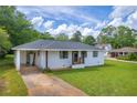 Attractive single-story house with a covered carport and a well-manicured front yard at 405 Emory St, Oxford, GA 30054