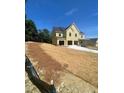 Expansive front yard with newly laid sod and construction in progress at 222 Silvercrest Dr, Acworth, GA 30101