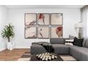 Comfortable living room featuring a gray sectional sofa, modern art, and stylish accents at 371 Grant Se Cir # 1823, Atlanta, GA 30315