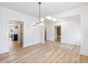 Spacious dining room with bright windows and a view into the gourmet kitchen at 4191 Hosch Reserve Dr, Buford, GA 30519