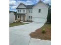 Charming two-story home with white siding, a covered porch, and a two-car garage at 171 Silvercrest Dr, Acworth, GA 30101