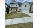 Charming two-story home with white siding, a covered porch, and a two-car garage at 171 Silvercrest Dr, Acworth, GA 30101