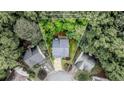 Aerial view of the property featuring approximate property lines, showcasing the home's position in a wooded cul-de-sac lot at 2022 Maple Ridge Nw Dr, Acworth, GA 30101