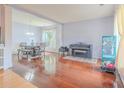 Open-concept living room and dining area features gleaming hardwood floors, natural light, and a flexible layout at 2022 Maple Ridge Nw Dr, Acworth, GA 30101